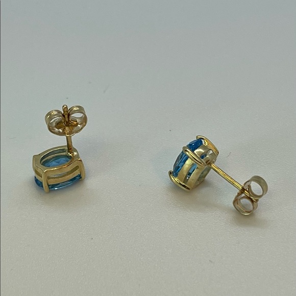 Solid 14K Yellow Gold Oval Swiss Blue Topaz Stud Earrings - Picture 2 of 4